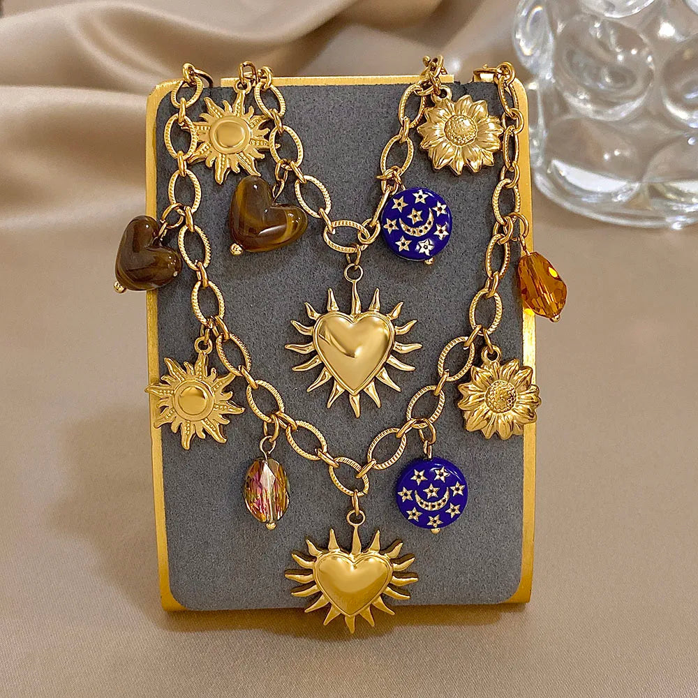 Gold sun and heart charm necklace and bracelet set with celestial pendants statement jewelry for women